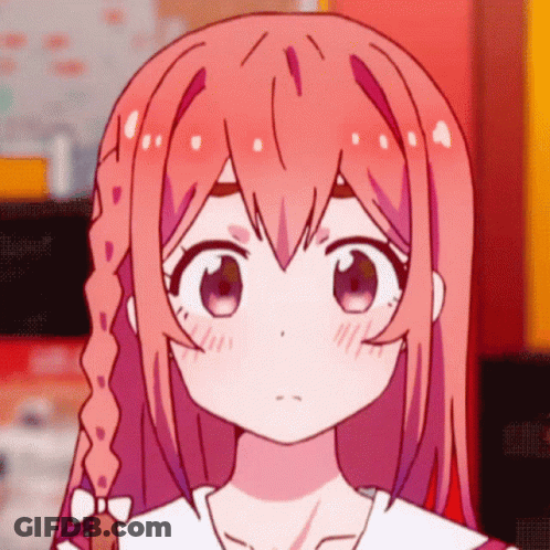 A Close Up Of A Girl 'S Face With Pink Hair And Purple Eyes GIF