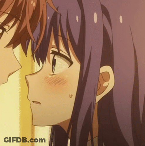 A Close Up Of A Girl 'S Face With Purple Hair GIF