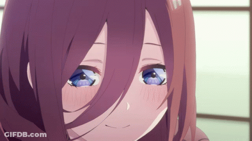 A Close Up Of A Girl 'S Face With Purple Hair And Blue Eyes GIF
