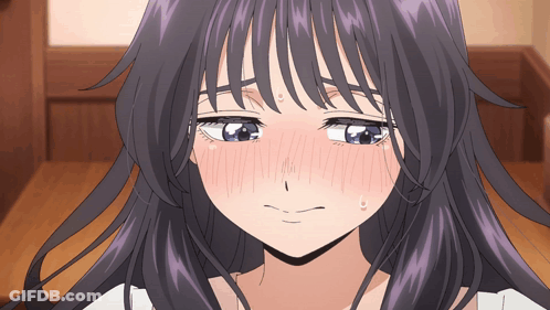 A Close Up Of A Girl 'S Face With Purple Hair And Blue Eyes GIF