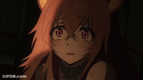 A Close Up Of A Girl 'S Face With Red Hair GIF