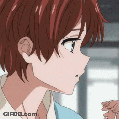 A Close Up Of A Girl 'S Face With Red Hair And A Blue Shirt GIF