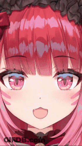 A Close Up Of A Girl 'S Face With Red Hair And Blue Eyes GIF