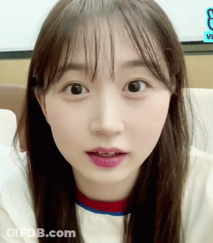 A Close Up Of A Girl 'S Face With The Letter E In The Corner GIF