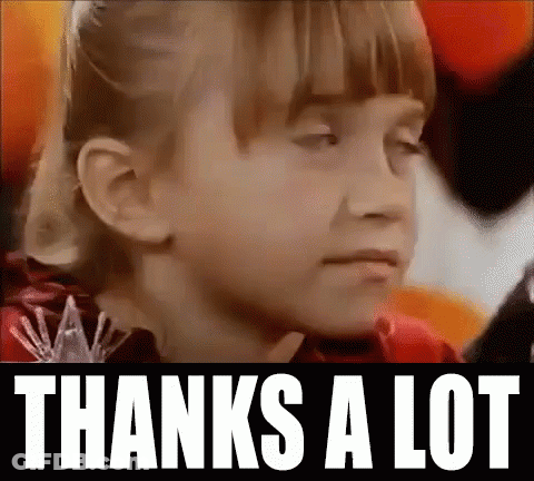 A Close Up Of A Girl 'S Face With The Words `` Thanks A Lot '' Written Above Her . GIF