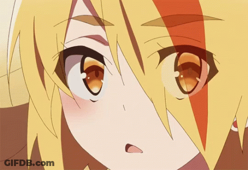 A Close Up Of A Girl 'S Face With Yellow Hair And Orange Eyes GIF