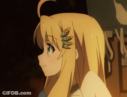 A Close Up Of A Girl 'S Head With A Few Feathers On Her Hair GIF