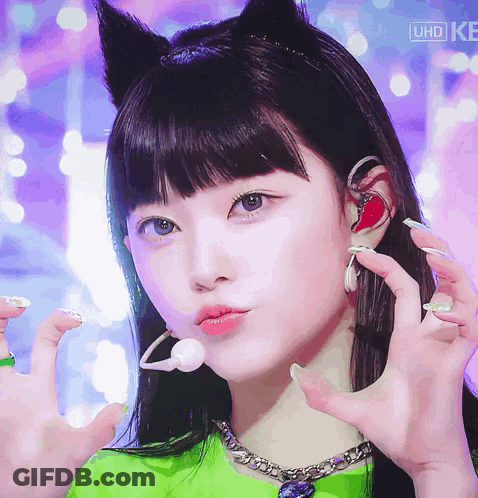 A Close Up Of A Girl Wearing A Headband With Cat Ears And Headphones GIF