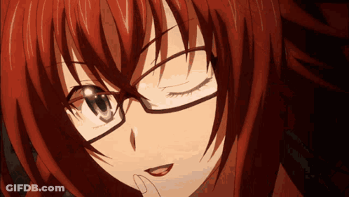 A Close Up Of A Girl Wearing Glasses With Red Hair GIF