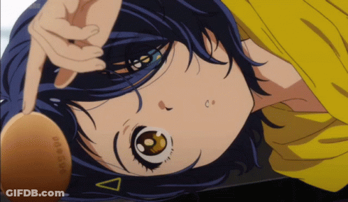 A Close Up Of A Girl With A Yellow Shirt And A Triangle On Her Head GIF