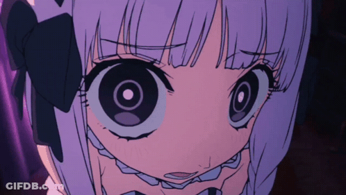A Close Up Of A Girl With Big Eyes GIF