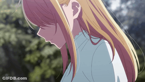 A Close Up Of A Girl With Blonde Hair GIF