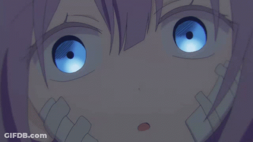 A Close Up Of A Girl With Blue Eyes GIF