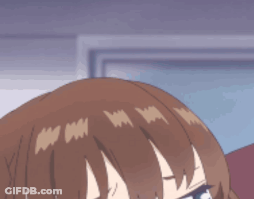 A Close Up Of A Girl With Brown Hair And Green Eyes GIF