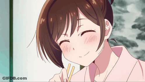 A Close Up Of A Girl With Chopsticks In Her Hand GIF