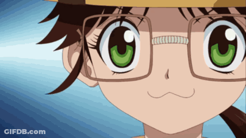 A Close Up Of A Girl With Glasses And A Yellow Hat GIF