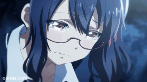 A Close Up Of A Girl With Glasses And Blue Hair Crying GIF