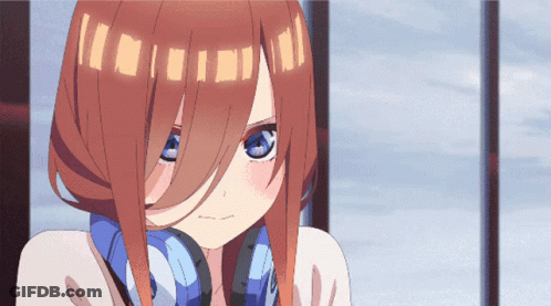 A Close Up Of A Girl With Headphones On Her Ears GIF