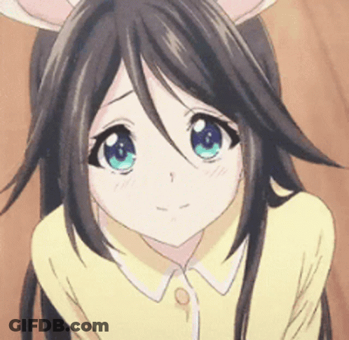 A Close Up Of A Girl With Long Hair And Blue Eyes GIF