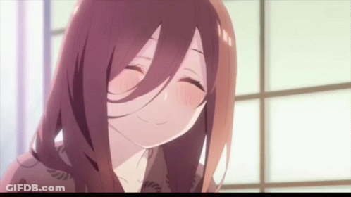 A Close Up Of A Girl With Long Hair Smiling GIF