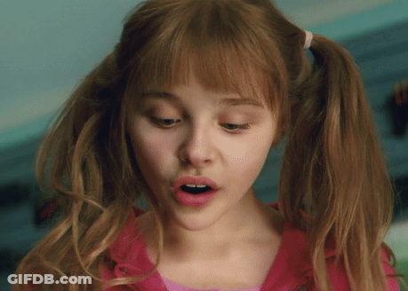 A Close Up Of A Girl With Pigtails And A Pink Shirt GIF