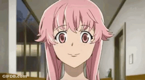 A Close Up Of A Girl With Pink Hair And Big Eyes . GIF