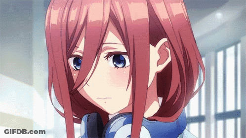 A Close Up Of A Girl With Red Hair And Blue Eyes . GIF