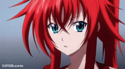 A Close Up Of A Girl With Red Hair And Blue Eyes GIF