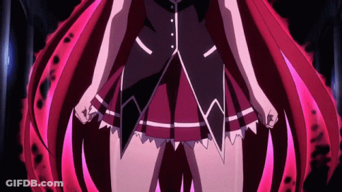 A Close Up Of A Girl With Red Hair In A Dark Room GIF