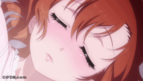 A Close Up Of A Girl With Red Hair Sleeping GIF