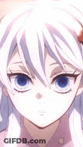 A Close Up Of A Girl With White Hair And Blue Eyes . GIF
