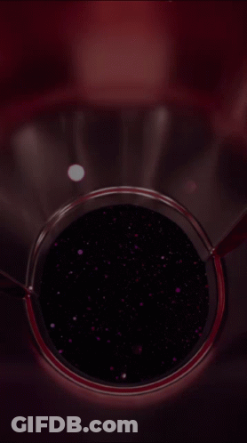 A Close Up Of A Glass Container With A Purple Liquid In It GIF