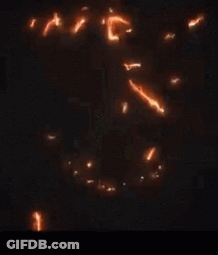 A Close Up Of A Glowing Dragon On A Black Background GIF