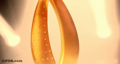 A Close Up Of A Gold Object With Rhinestones GIF