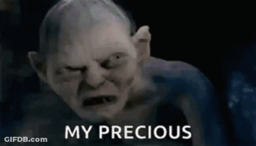 A Close Up Of A Gollum From The Lord Of The Rings With The Words `` My Precious '' Written Next To Him . GIF