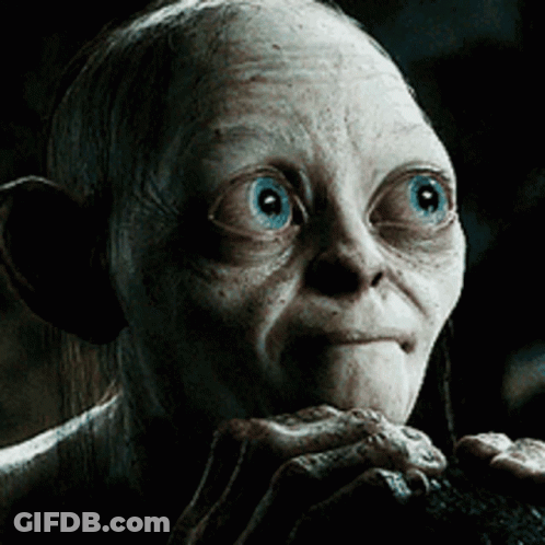 A Close Up Of A Gollum With Blue Eyes Looking At The Camera GIF