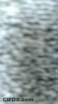 A Close Up Of A Gray Background With A Blurred Image Of A Waterfall . GIF