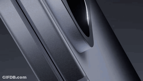A Close Up Of A Gray Metal Object With A Black Circle In The Middle GIF
