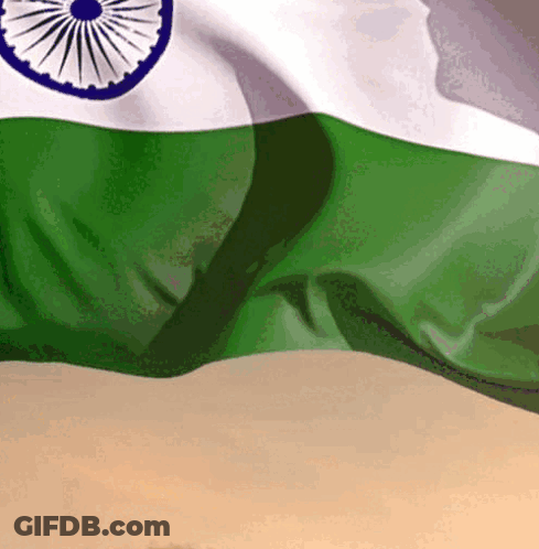 A Close Up Of A Green And White Indian Flag Waving In The Wind GIF