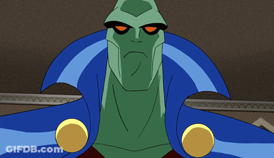A Close Up Of A Green Cartoon Character With Yellow Eyes GIF