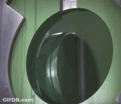 A Close Up Of A Green Circle In A Machine GIF