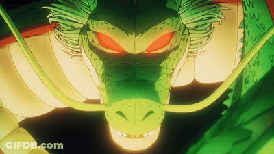 A Close Up Of A Green Dragon With Red Eyes And A Long Tail GIF