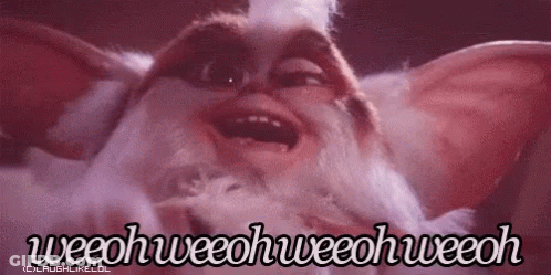 A Close Up Of A Gremlin From The Movie Gremlins Making A Funny Face With Its Mouth Open . GIF