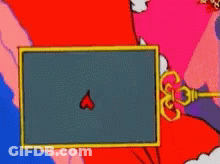 A Close Up Of A Grinch Face With Blue Eyes GIF