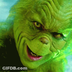 A Close Up Of A Grinch 'S Face With A Smile On It GIF
