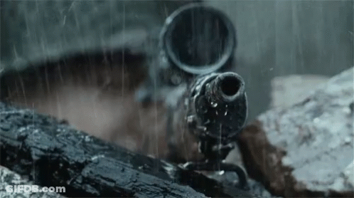 A Close Up Of A Gun In The Rain With Water Coming Out Of It GIF