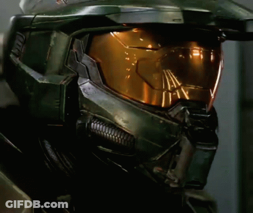 A Close Up Of A Halo Helmet With A Yellow Glowing Lens GIF
