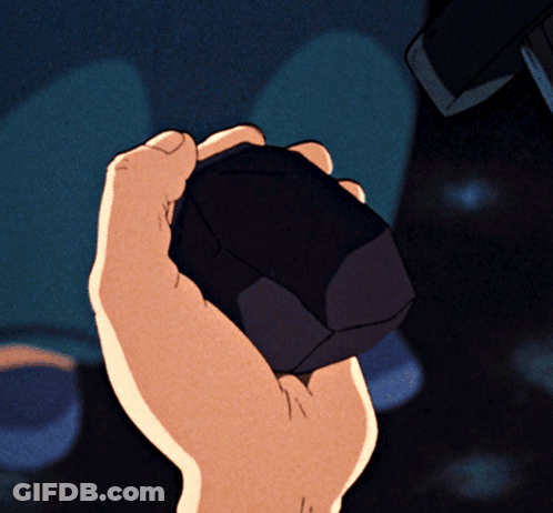 Close-Up Of Hand Holding Cube GIF