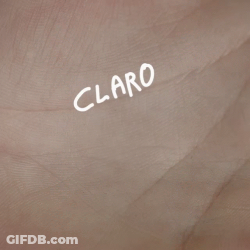 A Close Up Of A Hand With The Words " Claro K Si " Written On It GIF
