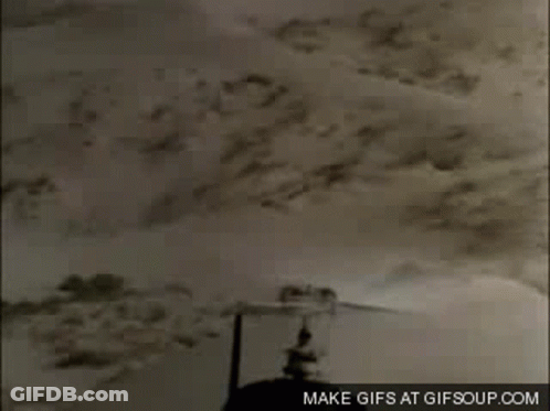 A Close Up Of A Helicopter Flying Over A Desert With The Words Make GIFs At Gifsoup.com On The Bottom GIF